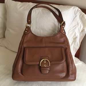 Coach bag with three large compartments.